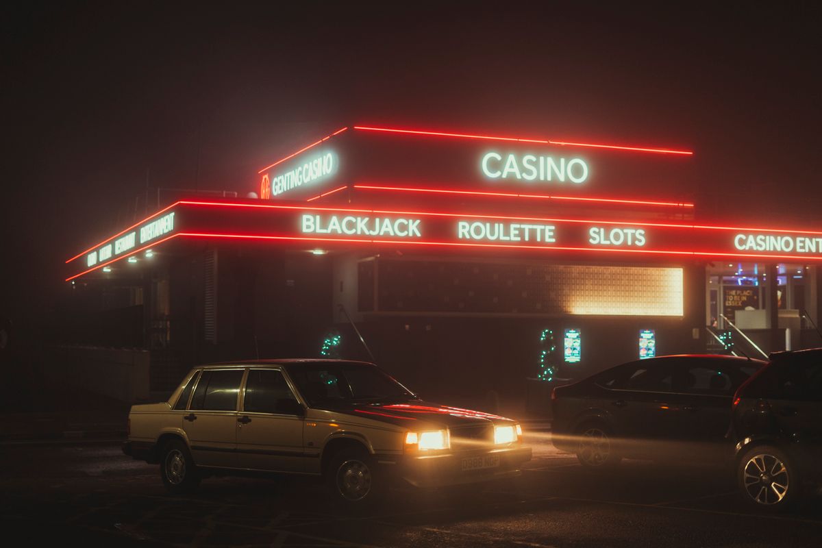 Casino gaming floor with players at tables